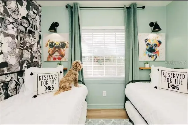 a bedroom with a bed and a window