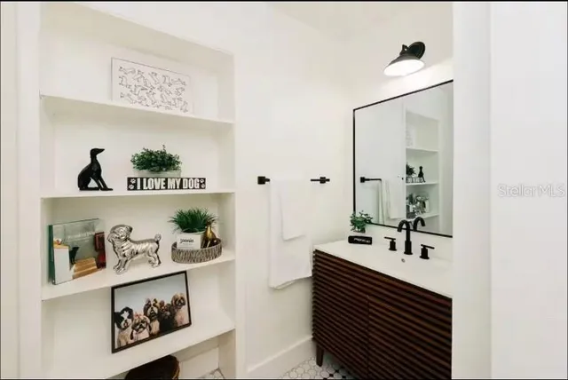 a view of a room with furniture and a potted plant