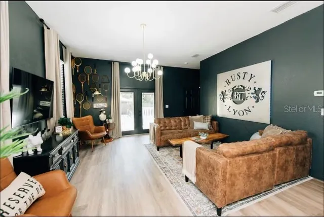 a table chair with wooden floor chairs and kitchen view