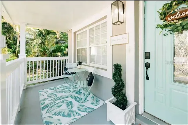 a view of a porch with furniture