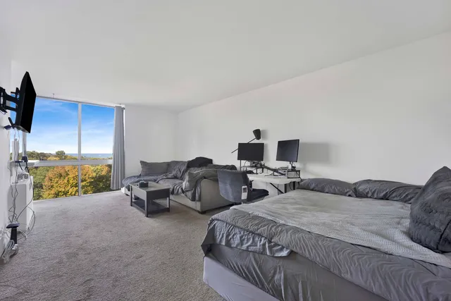 a bedroom with two beds and a couch