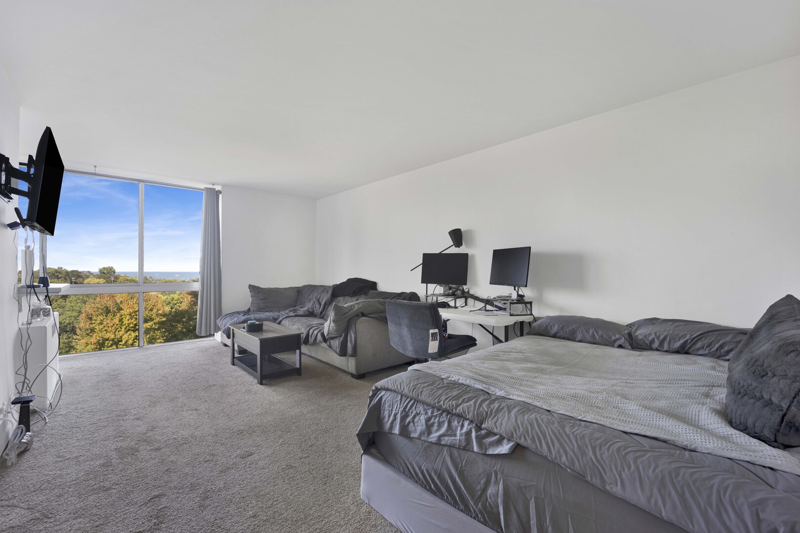 1555 North Dearborn Parkway, Unit 8C Chicago, IL 60610 - Photo 2 of 20 a bedroom with two beds and a couch