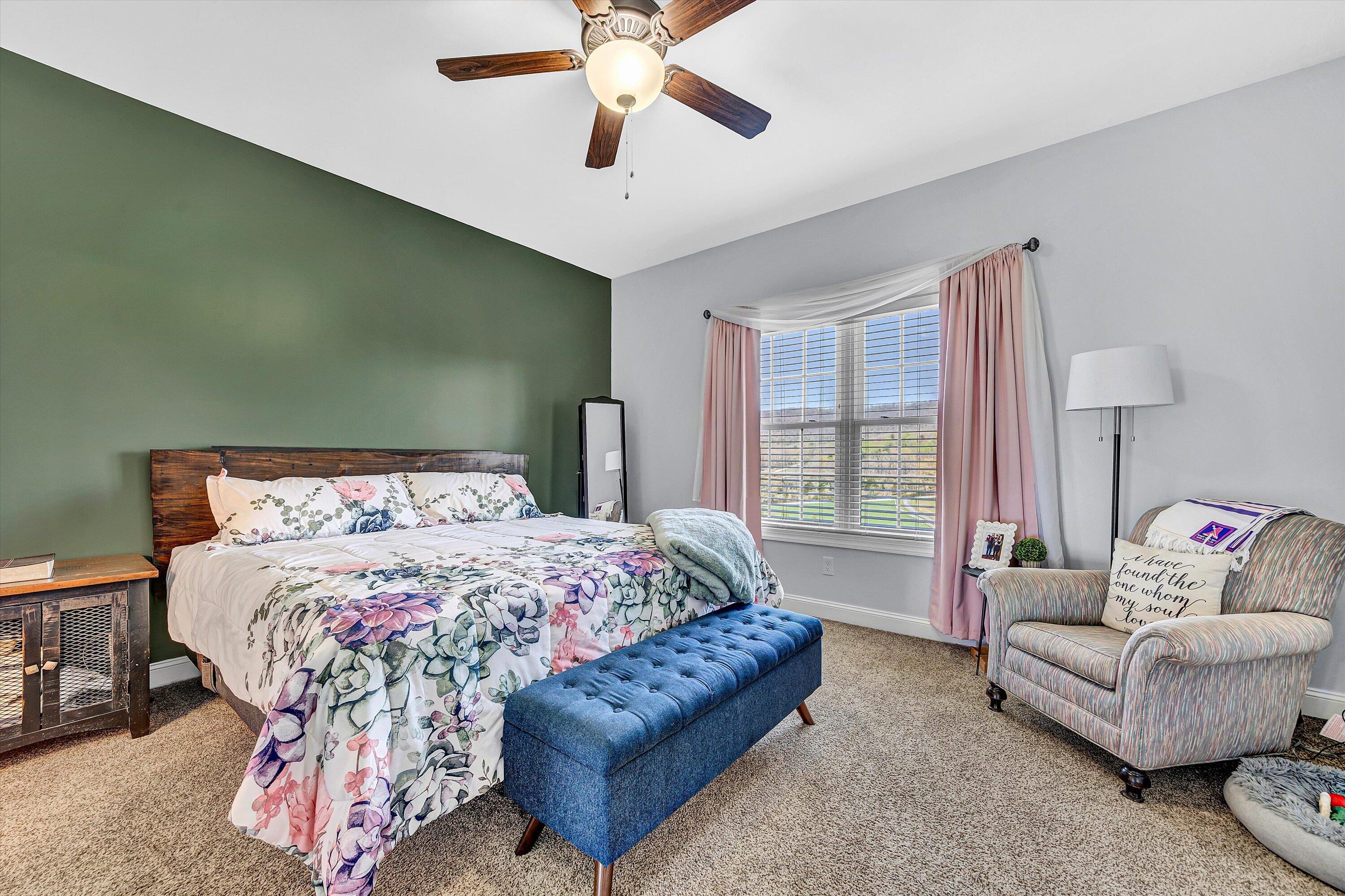 8350 Newport Road Catawba, VA 24070 - Photo 19 of 75 a bedroom with a bed couch and a large window