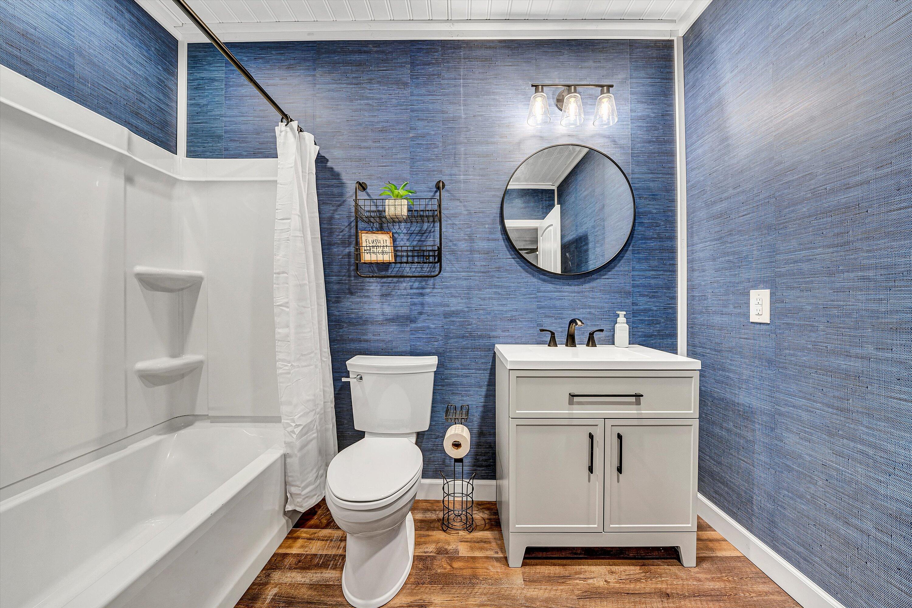 8350 Newport Road Catawba, VA 24070 - Photo 37 of 75 a bathroom with a toilet a sink and mirror