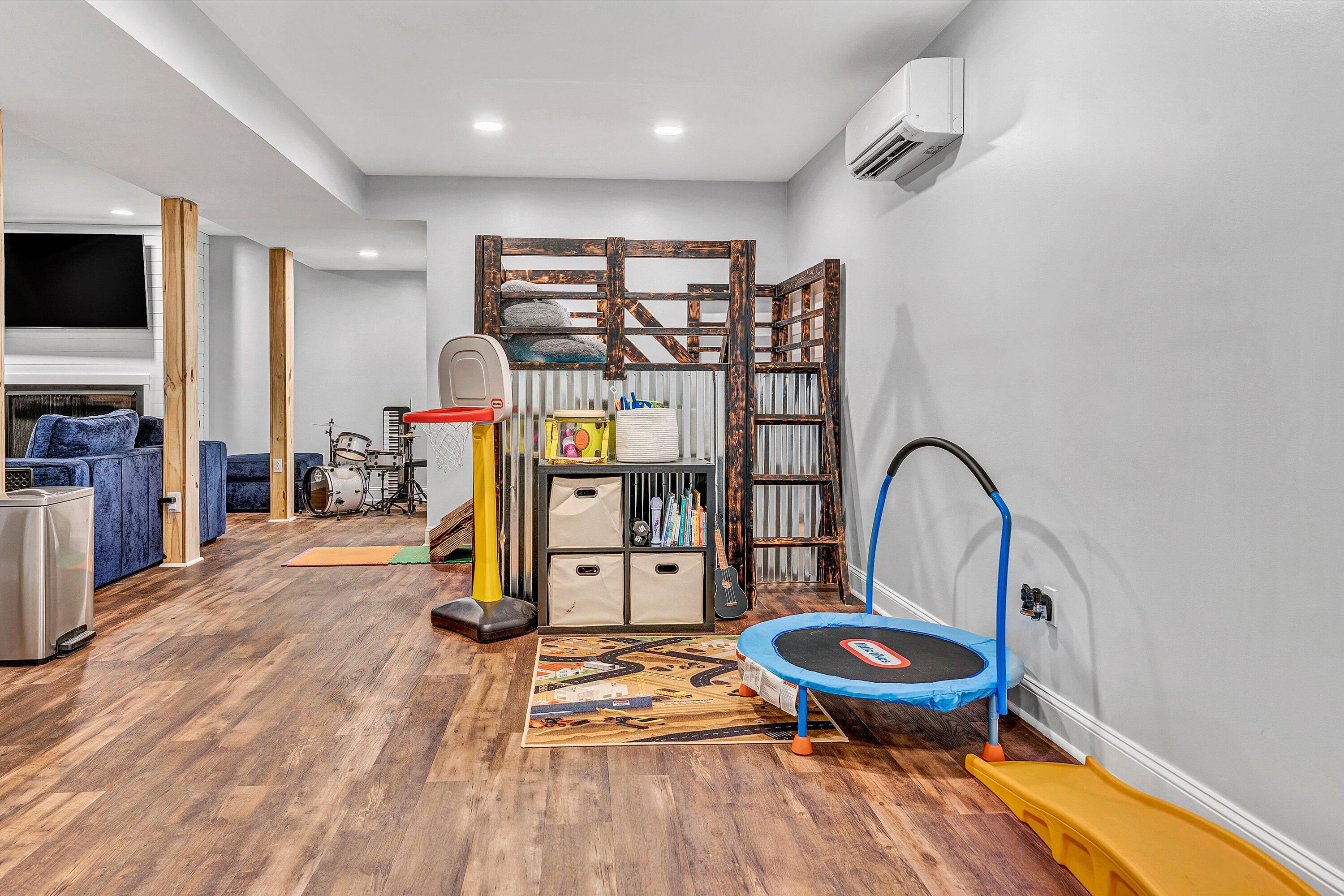 8350 Newport Road Catawba, VA 24070 - Photo 39 of 75 a living room with furniture a flat screen tv and floor to ceiling window