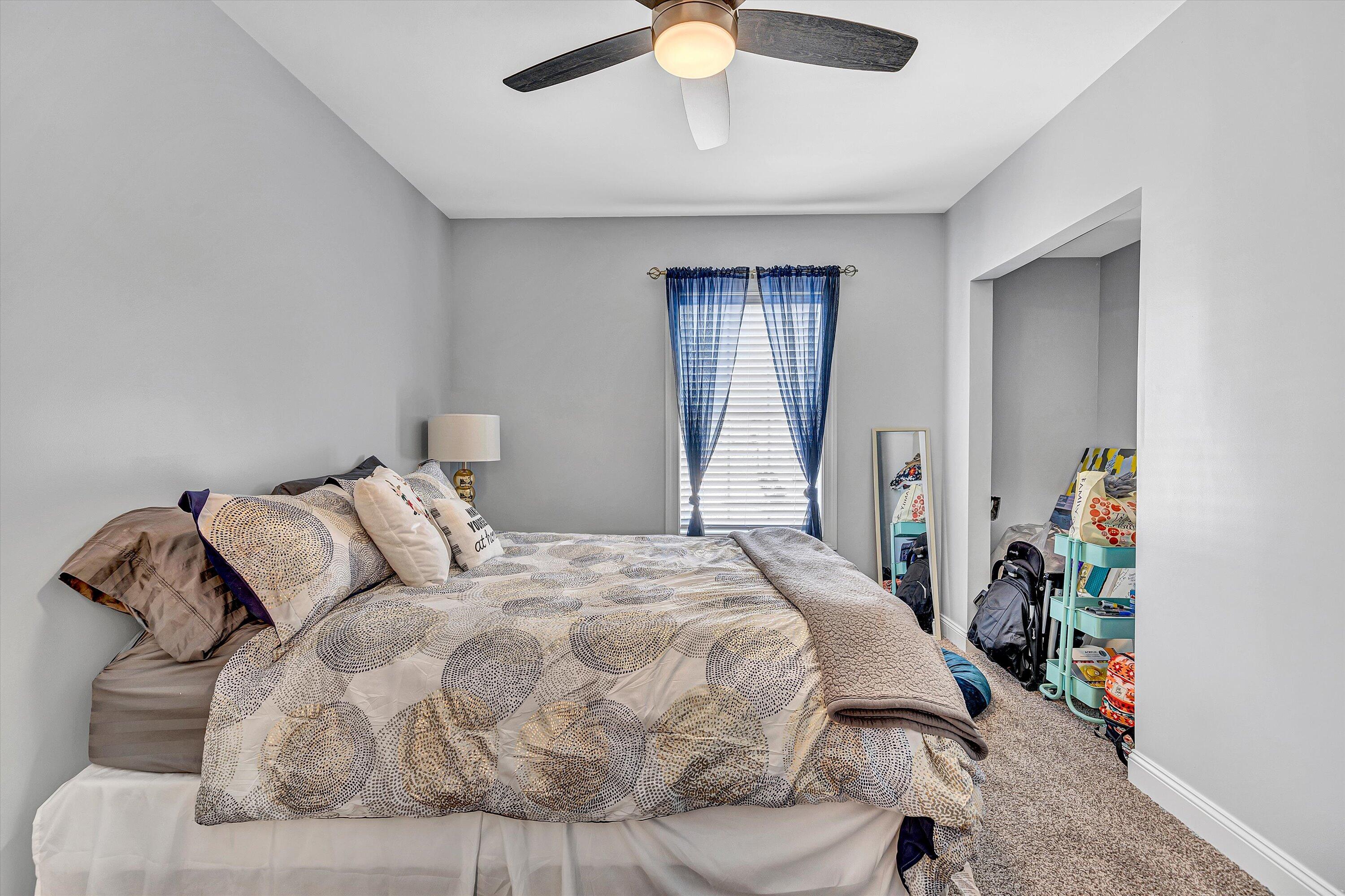 8350 Newport Road Catawba, VA 24070 - Photo 40 of 75 a bedroom with a bed and a chandelier