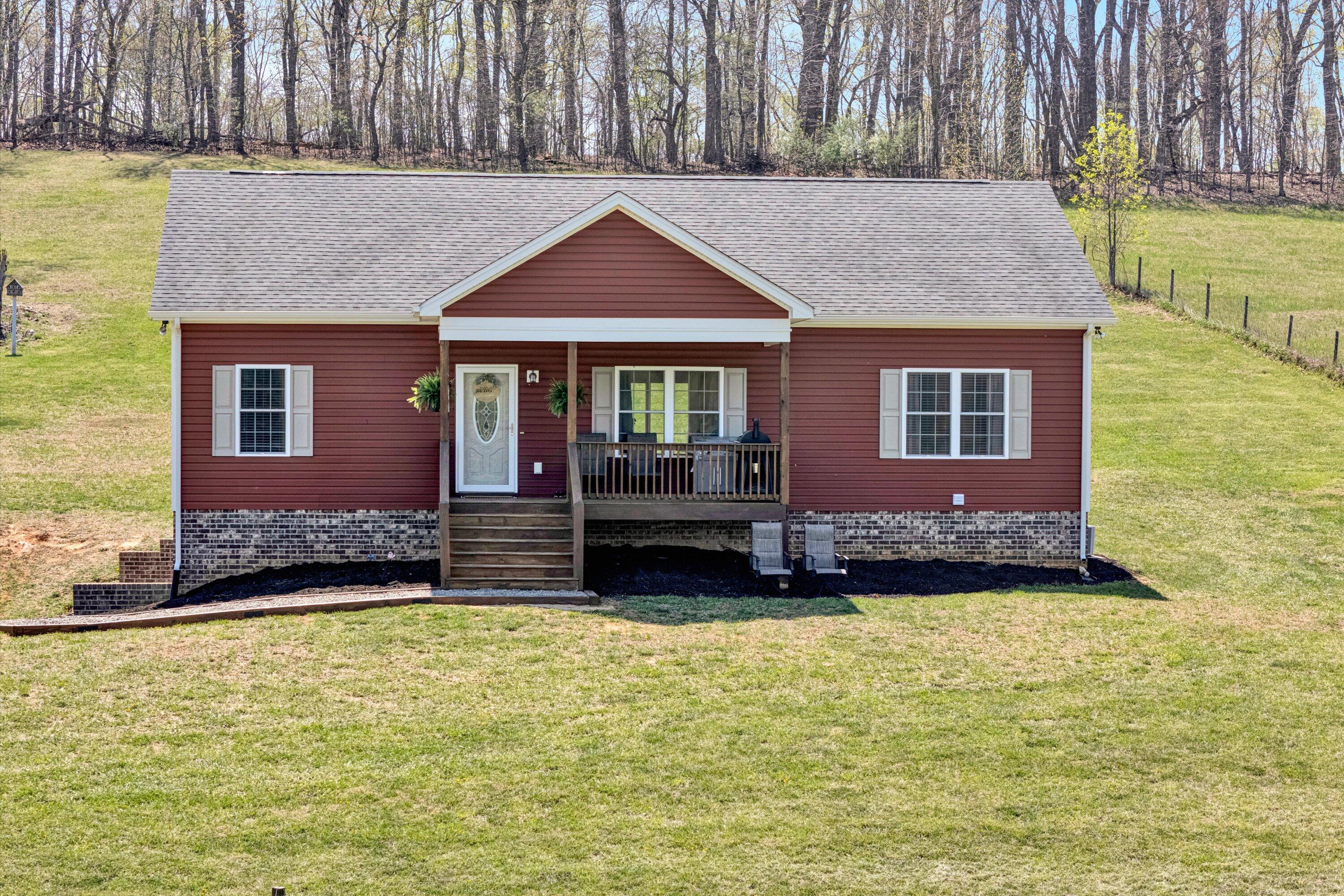 8350 Newport Road Catawba, VA 24070 - Photo 4 of 75 a front view of a house with a yard