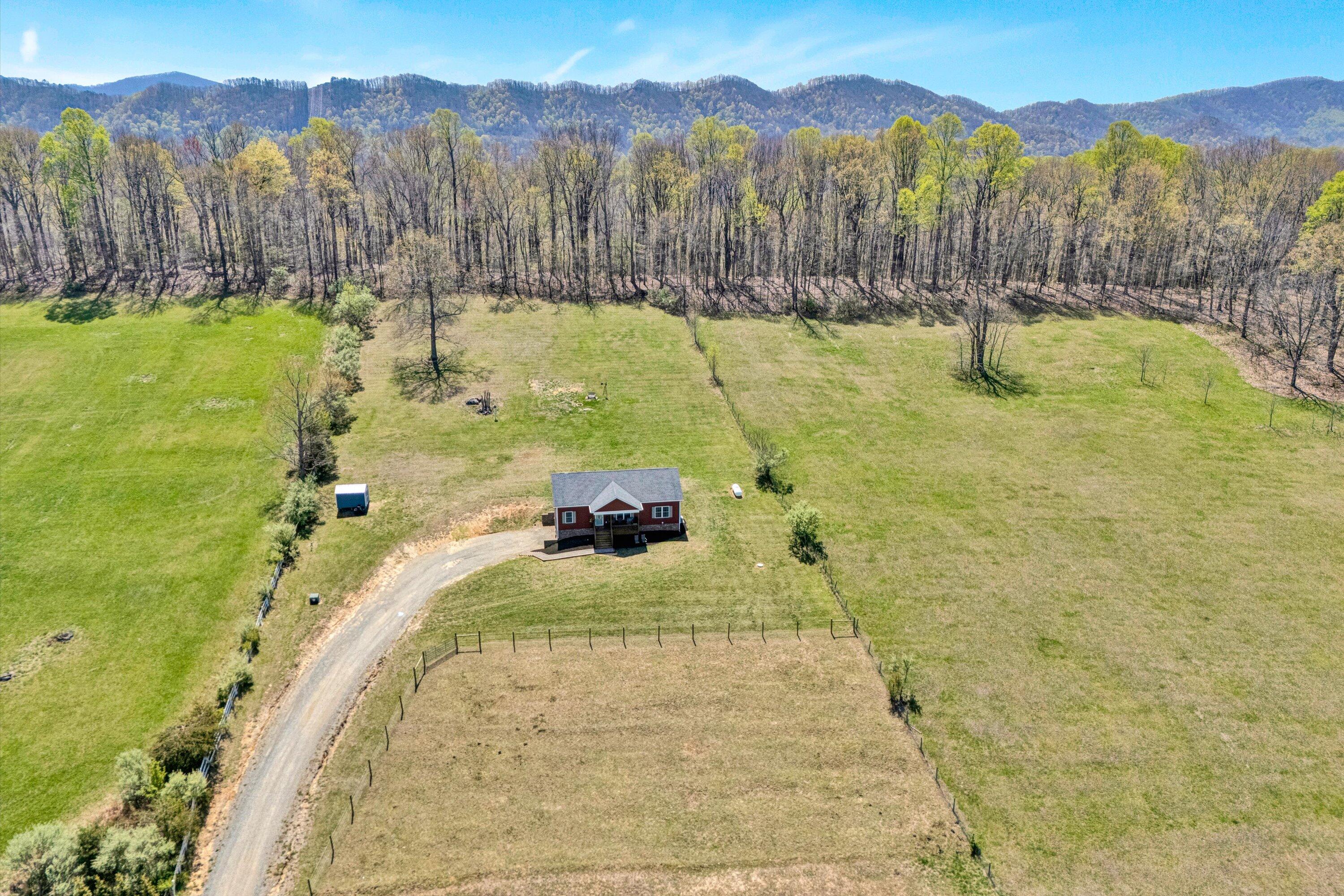 8350 Newport Road Catawba, VA 24070 - Photo 52 of 75 a view of a swimming pool with a yard and a large tree