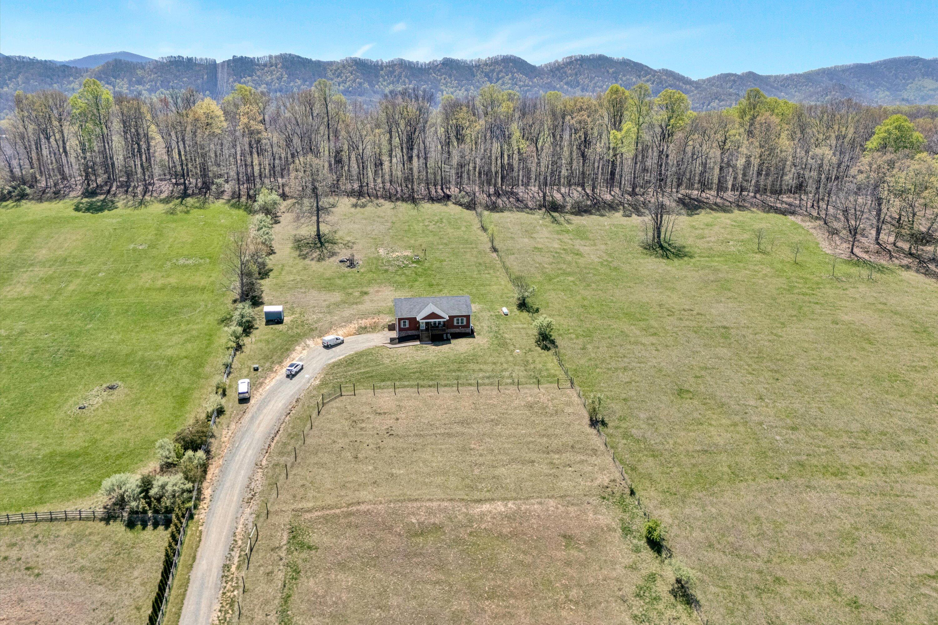 8350 Newport Road Catawba, VA 24070 - Photo 53 of 75 a view of a swimming pool with a yard and a large tree