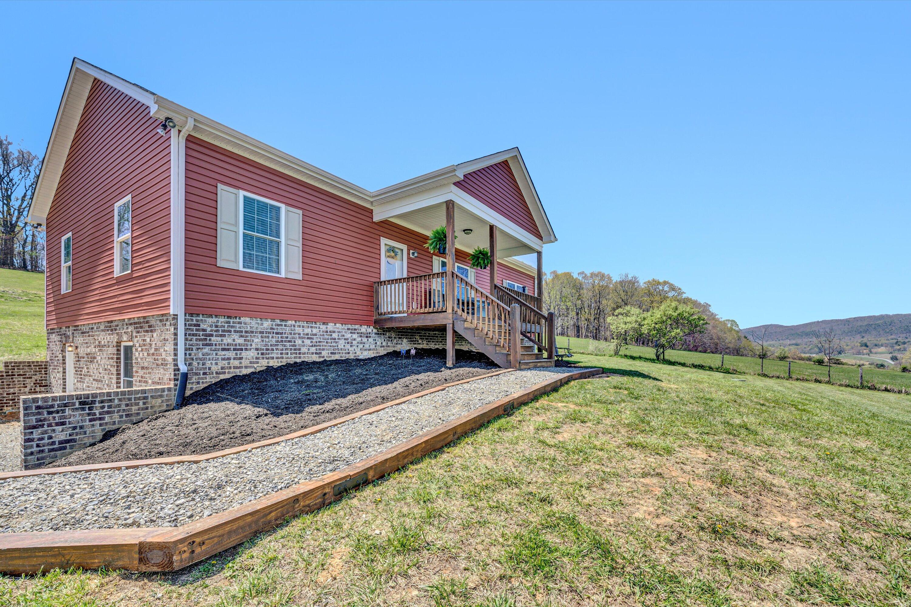 8350 Newport Road Catawba, VA 24070 - Photo 6 of 75 a front view of a house with a yard
