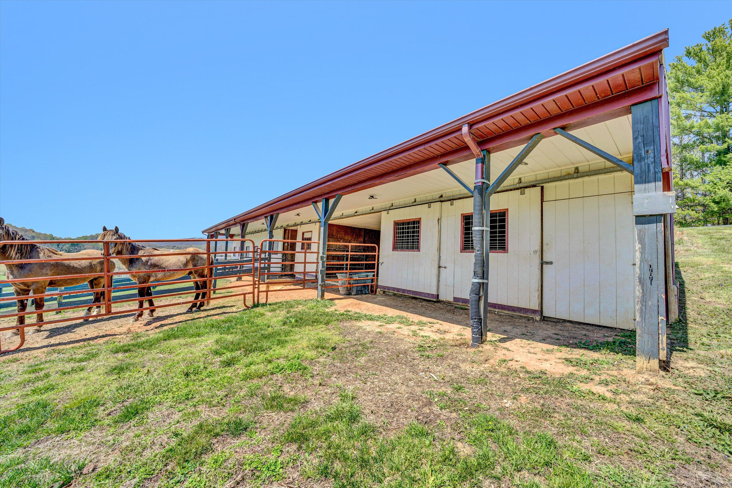 8350 Newport Road Catawba, VA 24070 - Photo 61 of 75 a backyard of a house with barbeque oven table and chairs