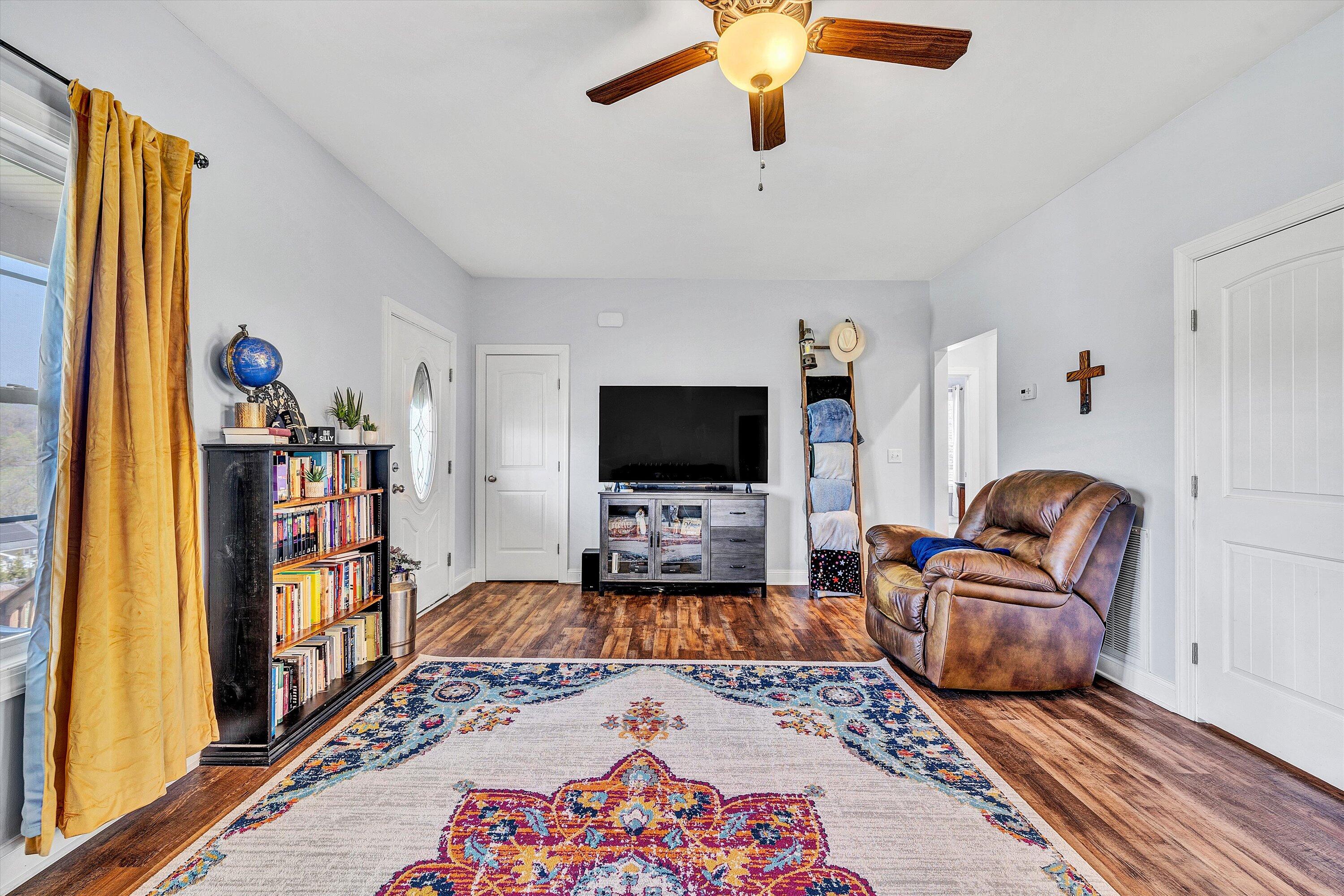 8350 Newport Road Catawba, VA 24070 - Photo 8 of 75 a living room with furniture and a flat screen tv