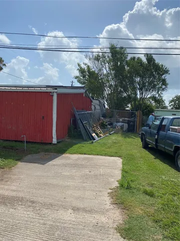 a backyard of a house with lots of green space and fountain