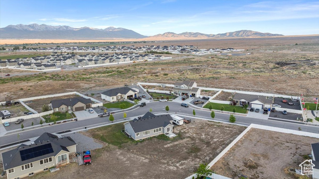 464 South Trejo Rdg Road Grantsville, UT 84029 - Photo 33 of 33 Aerial view of residential area featuring a mountainous background and a desert landscape