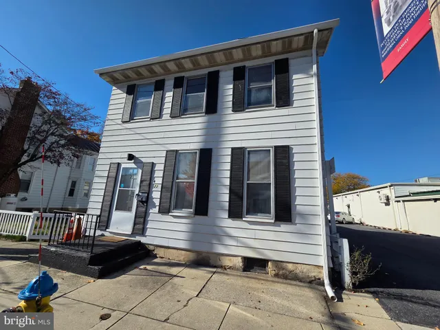 a front view of a house with a porch