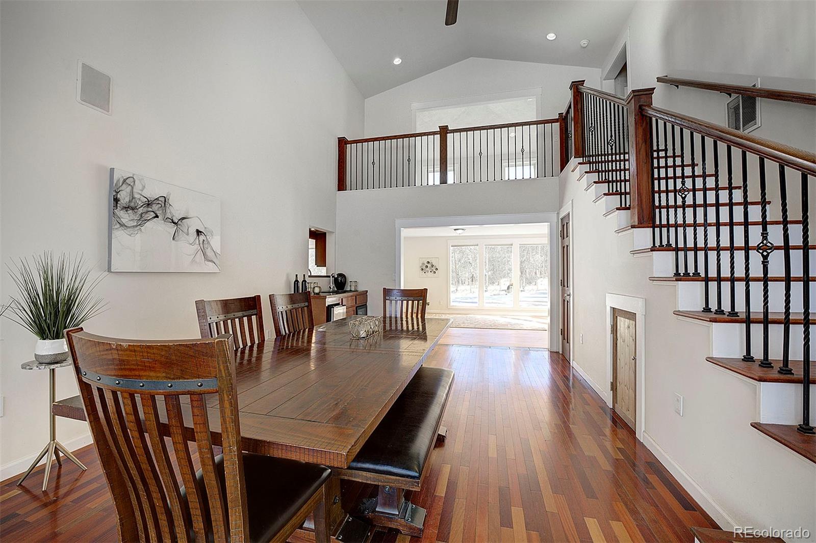 27987 Pine Grove Trail Conifer, CO 80433 - Photo 13 of 37 a view of a dining room with furniture window and wooden floor
