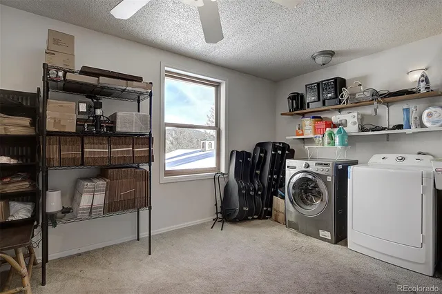 a view of a storage & utility room with washer and dryer