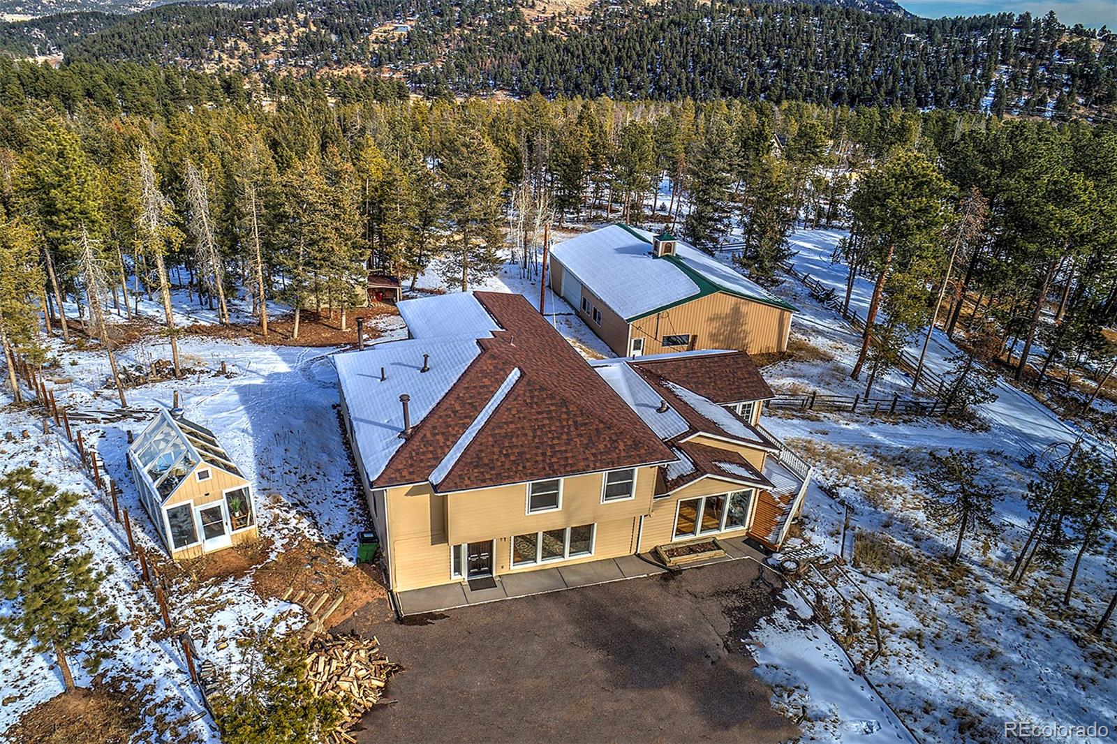 27987 Pine Grove Trail Conifer, CO 80433 - Photo 2 of 37 an aerial view of a house with a ocean view