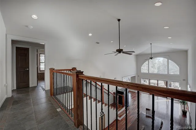 a view of a hallway with a chandelier