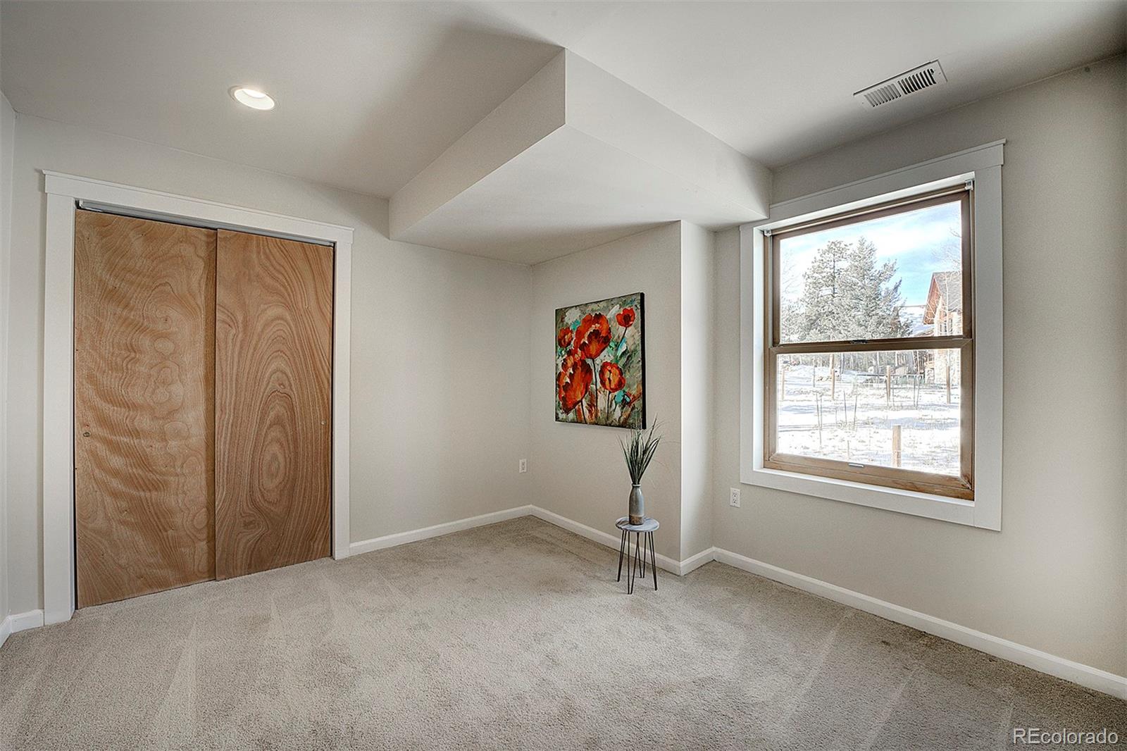 27987 Pine Grove Trail Conifer, CO 80433 - Photo 24 of 37 a view of an empty room with a window