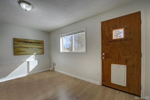 a view of empty room with windows