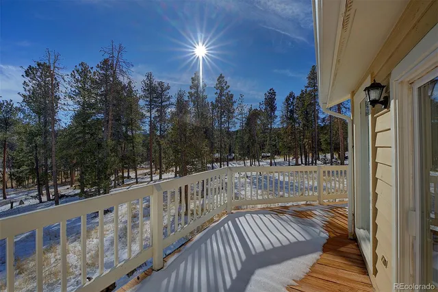 a view of balcony with wooden floor and outdoor space