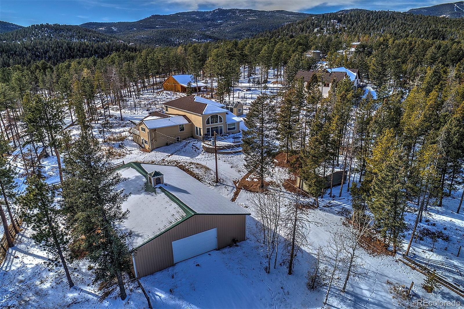 27987 Pine Grove Trail Conifer, CO 80433 - Photo 37 of 37 a view of a lake with a mountain