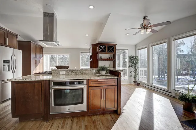a kitchen with a stove and a sink