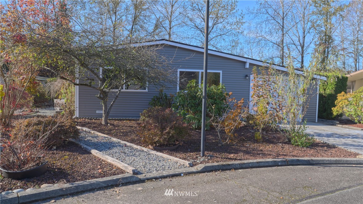 1128 Lake View Circle Bothell, WA 98021 - Photo 2 of 25 a view of a house with a yard and tree