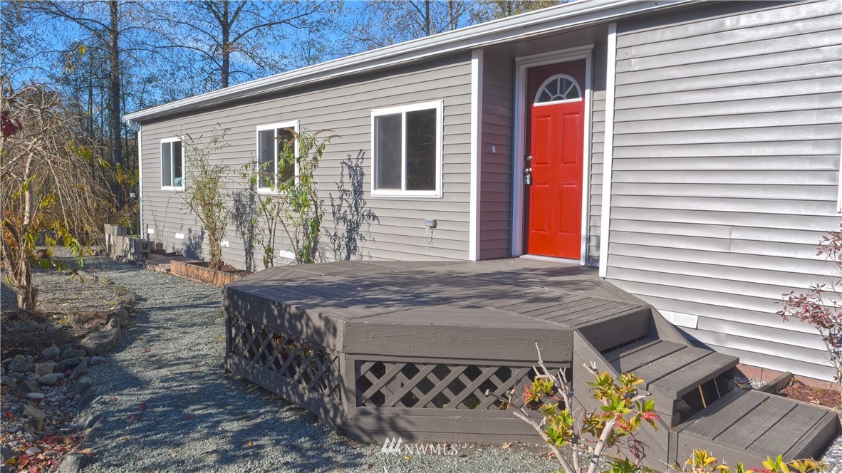 1128 Lake View Circle Bothell, WA 98021 - Photo 3 of 25 a view of a house with a patio and a yard
