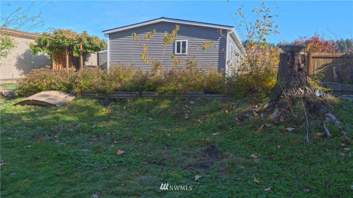 1128 Lake View Circle Bothell, WA 98021 - Photo 22 of 25 a view of a house with a yard