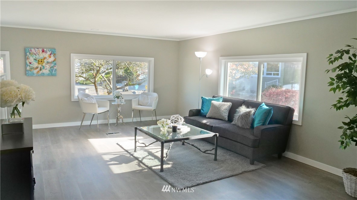 1128 Lake View Circle Bothell, WA 98021 - Photo 4 of 25 a living room with furniture and a large window