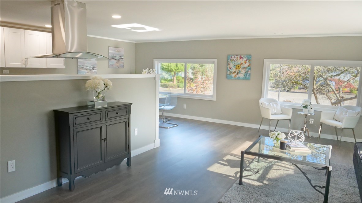 1128 Lake View Circle Bothell, WA 98021 - Photo 5 of 25 a kitchen with a table and chairs in it