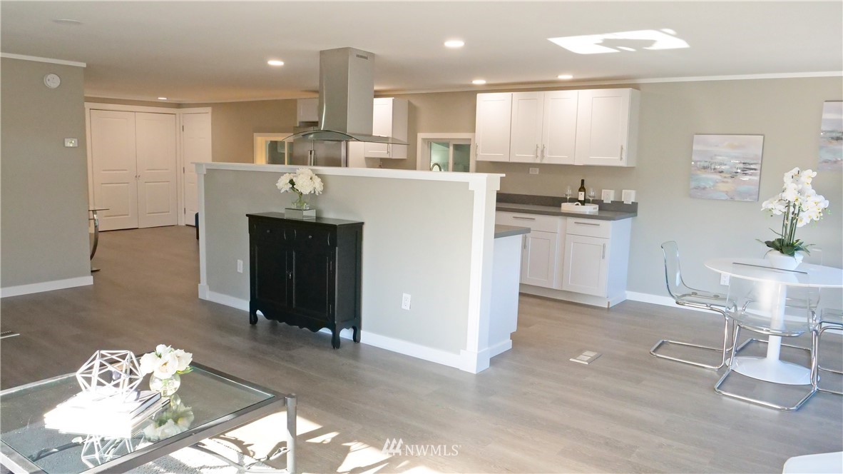 1128 Lake View Circle Bothell, WA 98021 - Photo 6 of 25 a large kitchen with a table and chairs