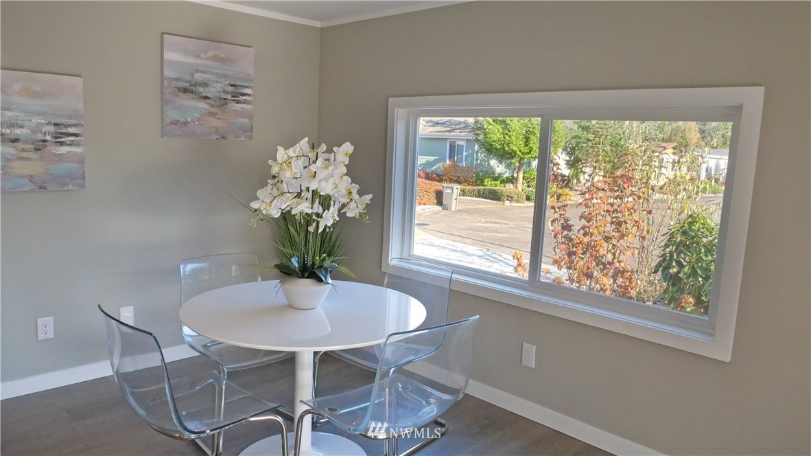 1128 Lake View Circle Bothell, WA 98021 - Photo 10 of 25 a dining room with furniture and a large window