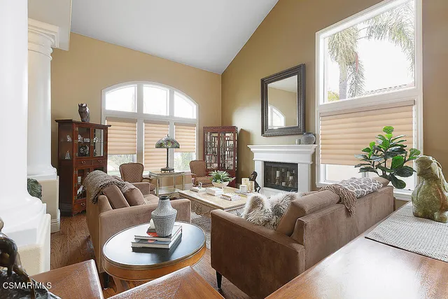a living room with furniture and a fireplace