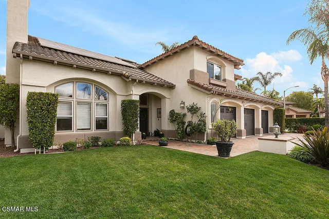 a view of a street with a cars parked on the road