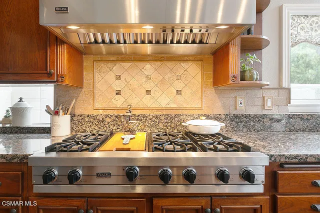 a bath tub sitting next to a bathroom sink