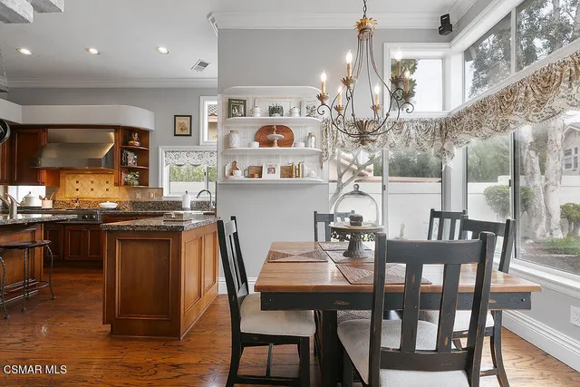 a spacious bathroom with a tub sink and mirror
