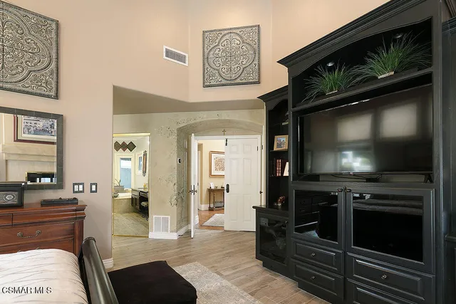 a view of a patio with swimming pool and sitting area