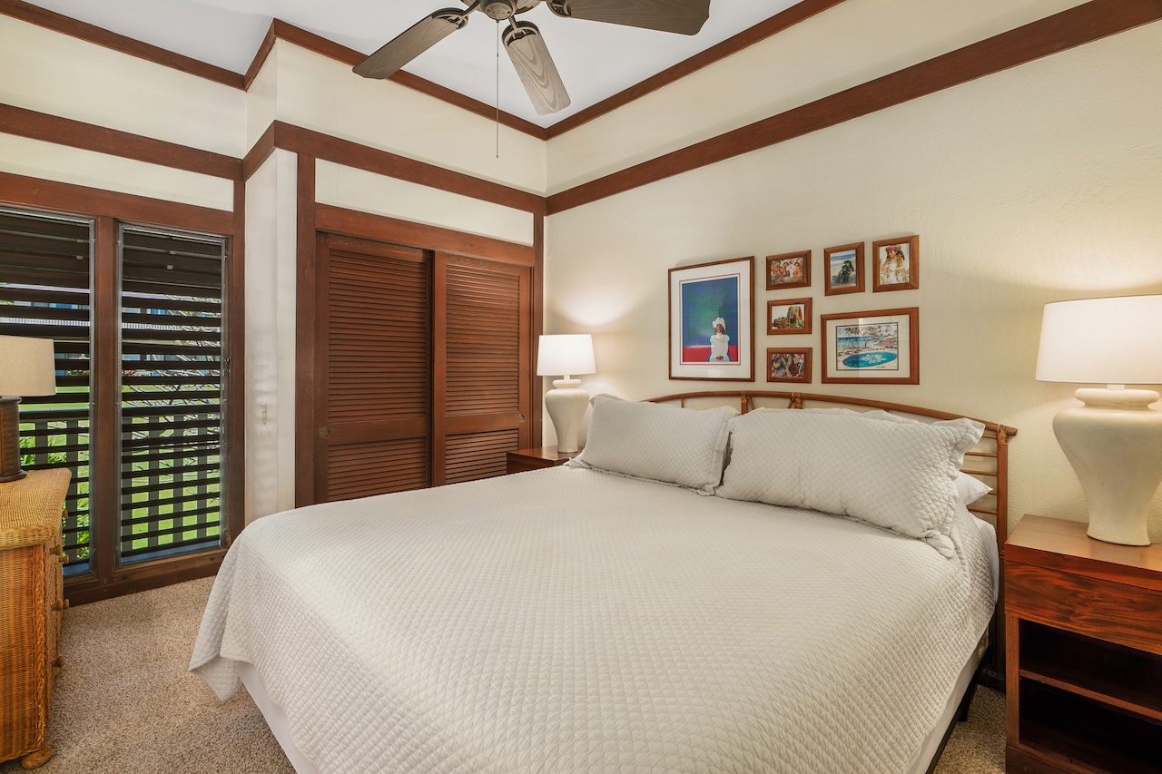 2253 Poipu Road, Unit 62 Koloa, HI 96756 - Photo 12 of 19 a bedroom with a bed and a painting on the wall
