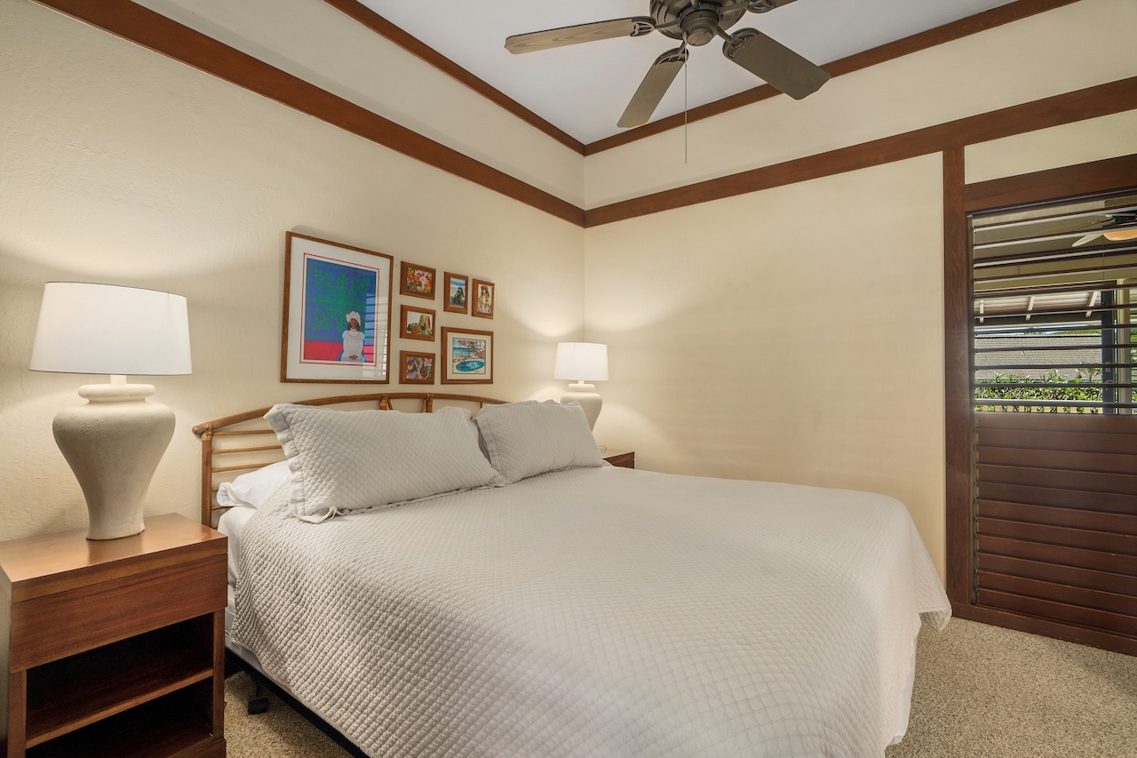 2253 Poipu Road, Unit 62 Koloa, HI 96756 - Photo 13 of 19 a bedroom with a bed a window and couch