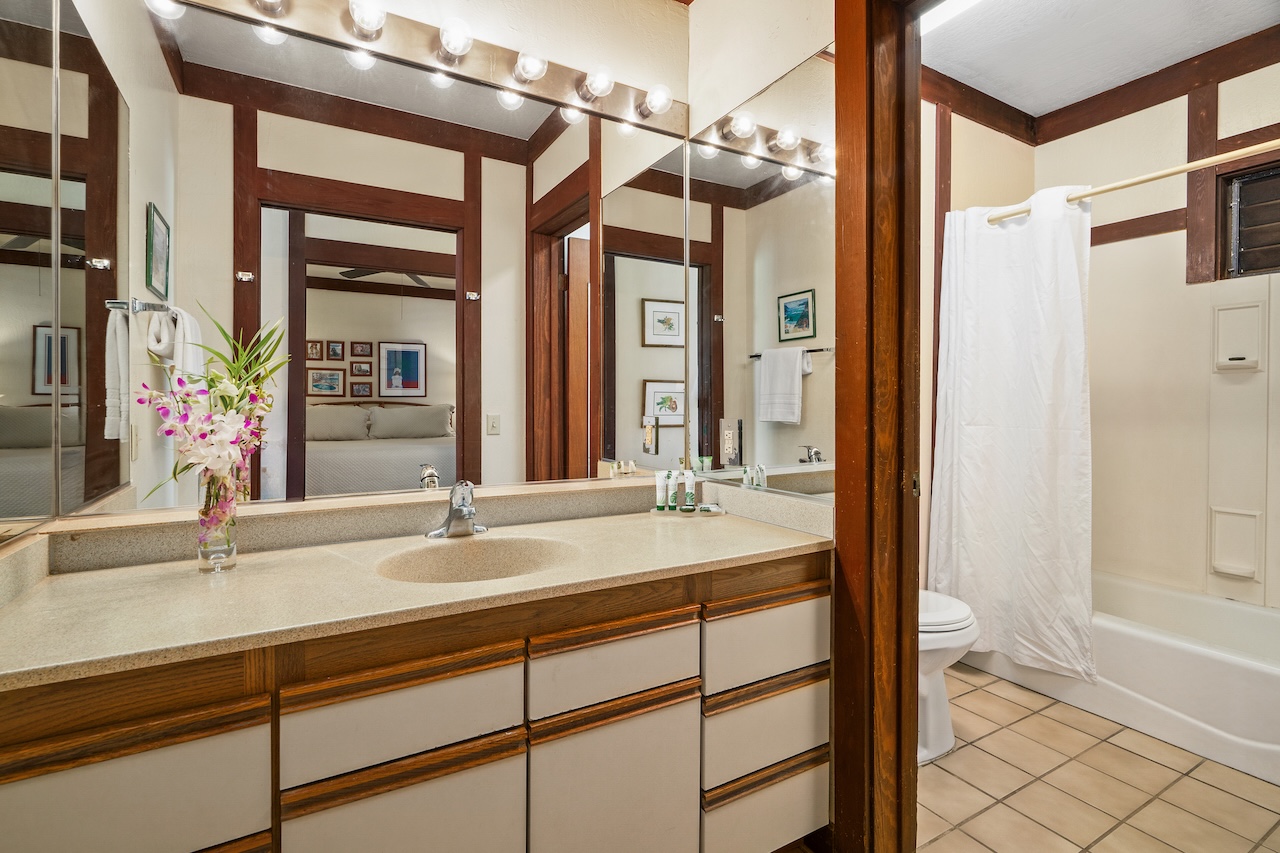 2253 Poipu Road, Unit 62 Koloa, HI 96756 - Photo 15 of 19 a bathroom with a sink and a mirror