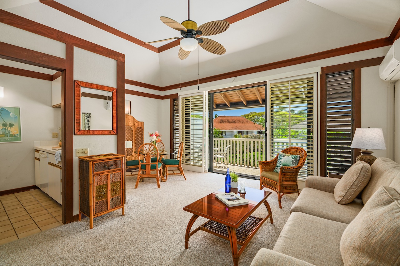 2253 Poipu Road, Unit 62 Koloa, HI 96756 - Photo 3 of 19 a living room with furniture and large windows