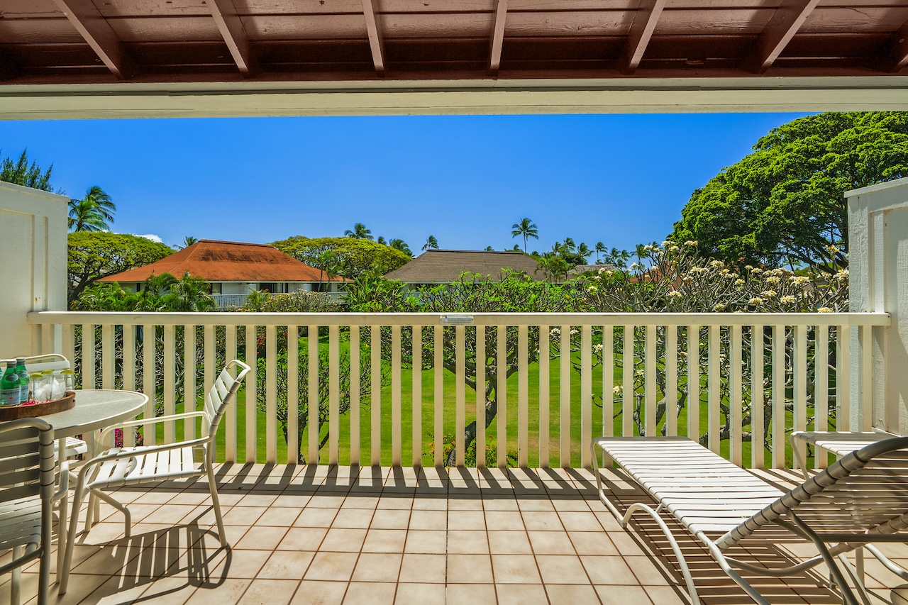 2253 Poipu Road, Unit 62 Koloa, HI 96756 - Photo 5 of 19 a view of a balcony with wooden floor and outdoor seating
