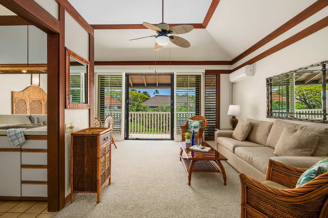 2253 Poipu Road, Unit 62 Koloa, HI 96756 - Photo 10 of 19 a living room with furniture and a large window