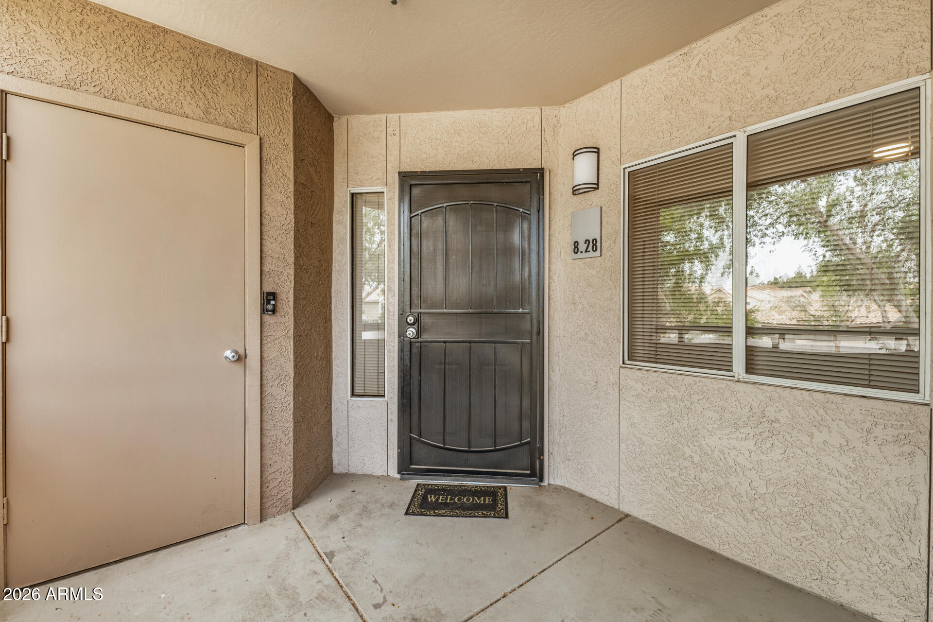 1295 North Ash Street, Unit 828 Gilbert, AZ 85233 - Photo 27 of 43 a view of an empty room with wooden floor and a window