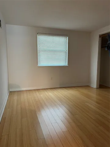 a kitchen with a sink cabinets and window