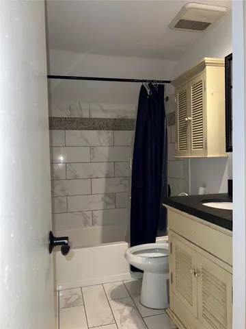 a view of a livingroom with furniture and wooden floor