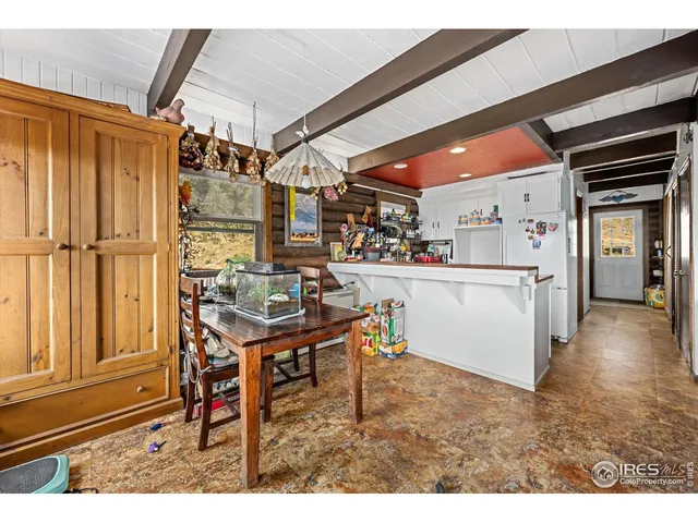 a living room with stainless steel appliances kitchen island granite countertop furniture and a kitchen view